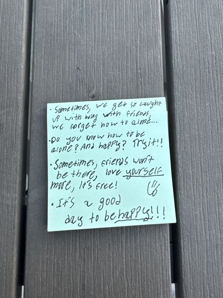 Handwritten sticky note with words of encouragement